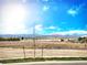 Wide view of a large lot, with majestic mountains in the background, ideal for building a dream home at 700 Lillibrook Pl, Erie, CO 80026