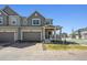 A lovely home with a covered front porch, an attached garage, and beautifully landscaped front yard at 700 Lillibrook Pl, Erie, CO 80026