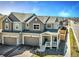 Charming townhome with two-car garage, covered porch, and neutral exterior paint in a well-maintained neighborhood at 700 Lillibrook Pl, Erie, CO 80026