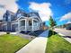 Beautiful home featuring manicured lawns and a cozy front porch perfect for relaxing outdoors at 700 Lillibrook Pl, Erie, CO 80026