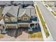 Aerial view of the home, highlighting the spacious garage, front porch, and attractive landscaping at 700 Lillibrook Pl, Erie, CO 80026