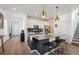 Stylish kitchen with a large island, pendant lighting, stainless steel appliances and modern finishes at 700 Lillibrook Pl, Erie, CO 80026