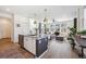 Open concept living room with contemporary furnishings, natural light, and stylish decor at 700 Lillibrook Pl, Erie, CO 80026