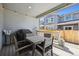 Covered patio perfect for outdoor dining features a table and chairs with string lights at 700 Lillibrook Pl, Erie, CO 80026