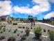 Community playground surrounded by engineered wood fiber and with residential homes in the background at 700 Lillibrook Pl, Erie, CO 80026