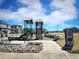 Community playground featuring slides, climbing structures, and seating areas amidst residential surroundings at 700 Lillibrook Pl, Erie, CO 80026