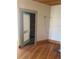 Bedroom showcasing hardwood floors and an open door to another room at 1901 N Emerson St, Denver, CO 80218