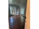 Bedroom with hardwood floors, radiator, and natural light from two windows at 1901 N Emerson St, Denver, CO 80218