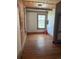 Bright bedroom features hardwood floors, exposed brick, and a large window at 1901 N Emerson St, Denver, CO 80218