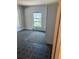 Bedroom with two windows and blue patterned linoleum flooring at 1901 N Emerson St, Denver, CO 80218