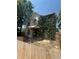 Exterior view of a two story home with climbing ivy and a covered porch at 1901 N Emerson St, Denver, CO 80218