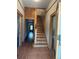 Foyer features hardwood floors, stairs, and wood trim at 1901 N Emerson St, Denver, CO 80218