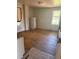 Kitchen features a refrigerator, hardwood floors, and exposed brick at 1901 N Emerson St, Denver, CO 80218