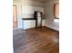 Kitchen featuring white cabinets, stainless steel appliances, and hardwood floors at 1901 N Emerson St, Denver, CO 80218