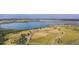 Wide aerial view of the neighborhood with a water reservoir and highway nearby at 13894 E Lehigh Ave # G, Aurora, CO 80014