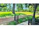 Expansive green backyard view highlighting lush grass, mature trees, and a serene, park-like setting at 13894 E Lehigh Ave # G, Aurora, CO 80014