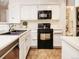 Kitchen featuring stainless steel appliances, modern cabinets, and ample counter space at 13894 E Lehigh Ave # G, Aurora, CO 80014