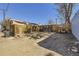 A back alley with gravel surface and a wooden fence at 1157 N Downing St, Denver, CO 80218