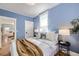 Comfortable bedroom with ample natural light and stylish decor at 1157 N Downing St, Denver, CO 80218