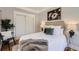 Bedroom with closet, neutral tones and a decorative flower print at 1157 N Downing St, Denver, CO 80218