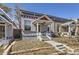 This single-Gathering home has a charming front porch, painted brick, and an inviting walkway at 1157 N Downing St, Denver, CO 80218