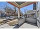 This porch has brick walls, white columns, and shade from the elements at 1157 N Downing St, Denver, CO 80218