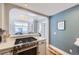 Kitchen view shows stove and archway into the bright dining and living area at 1157 N Downing St, Denver, CO 80218