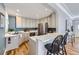 Well-lit kitchen featuring updated cabinets, stainless steel appliances, and a breakfast bar at 1157 N Downing St, Denver, CO 80218