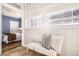 Bright sunroom featuring white walls, tile floor, multiple windows, and a view to the bedroom at 1157 N Downing St, Denver, CO 80218