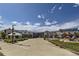 Outdoor courtyard with a yurt, modern buildings, and play structure at 24736 E Evans Dr, Aurora, CO 80018