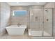 Bathroom with soaking tub and walk-in shower at 3432 N Gold Bug Ct, Aurora, CO 80019