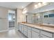 Elegant bathroom with double vanity, soaking tub, and walk-in shower at 3432 N Gold Bug Ct, Aurora, CO 80019