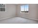 Simple bedroom with carpeted floors and a window at 3432 N Gold Bug Ct, Aurora, CO 80019