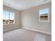 Well-lit bedroom with neutral walls and carpet flooring at 3432 N Gold Bug Ct, Aurora, CO 80019