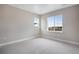 Spacious bedroom featuring carpeted floors and a window with a view at 3432 N Gold Bug Ct, Aurora, CO 80019