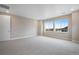 Well-lit bedroom with large windows and views at 3432 N Gold Bug Ct, Aurora, CO 80019