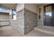 Exterior view of front entrance with stone and wood accents at 3432 N Gold Bug Ct, Aurora, CO 80019