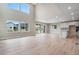 Open concept kitchen and living area with hardwood floors at 3432 N Gold Bug Ct, Aurora, CO 80019