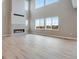 Bright living room with hardwood floors and large windows at 3432 N Gold Bug Ct, Aurora, CO 80019