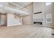 Two-story living room featuring a fireplace and hardwood floors at 3432 N Gold Bug Ct, Aurora, CO 80019