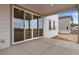 Covered patio with sliding glass doors and backyard view at 3432 N Gold Bug Ct, Aurora, CO 80019