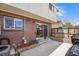 Backyard with a brick wall, a fence, and a sliding glass door at 8666 Mariposa St, Thornton, CO 80260