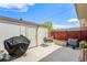 Backyard features concrete patio, grill, raised garden beds and storage shed at 8666 Mariposa St, Thornton, CO 80260