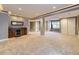 The basement is complete with a bar and built-in shelves, and includes a carpeted area at 7890 S Quatar, Aurora, CO 80016