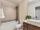 Updated bathroom features a shower-tub combo and a single sink at 7890 S Quatar, Aurora, CO 80016