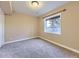 Bedroom has carpet, one window, and neutral-painted walls at 7890 S Quatar, Aurora, CO 80016