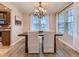 Elegant dining room with a chandelier and abundant natural light at 7890 S Quatar, Aurora, CO 80016