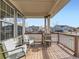 Inviting front porch featuring comfortable seating and charming neighborhood views at 7890 S Quatar, Aurora, CO 80016