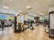 Community gym featuring updated equipment, mirrors, and plenty of room to exercise at 7890 S Quatar, Aurora, CO 80016