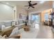 Bright, open living room with a cozy fireplace, natural light, and modern decor at 7890 S Quatar, Aurora, CO 80016